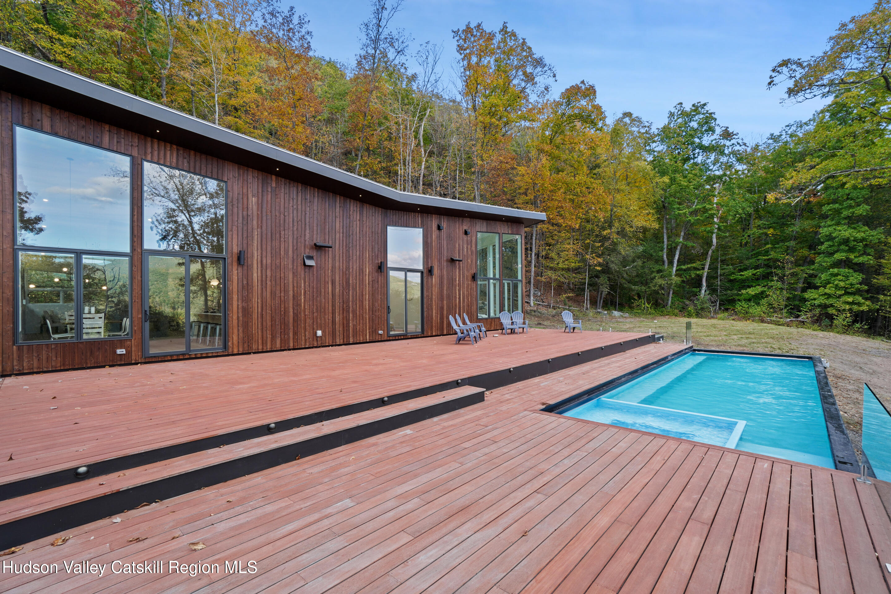 a view of outdoor space with deck and living room