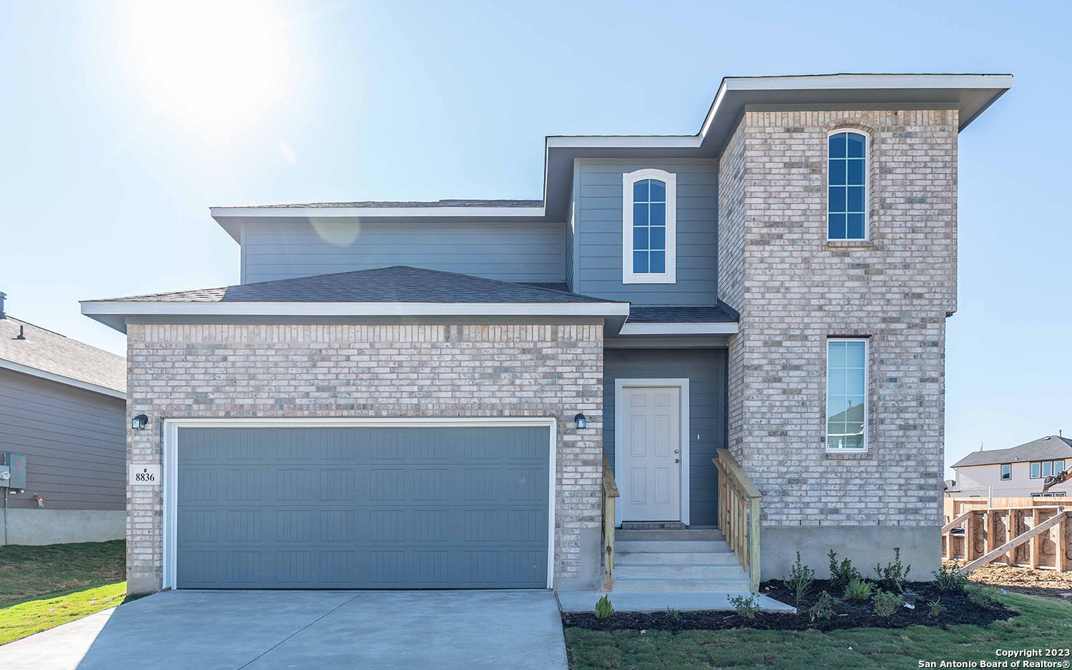 a front view of a house with yard