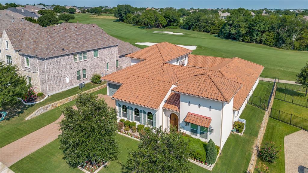 an aerial view of a house with swimming pool a patio and garden view