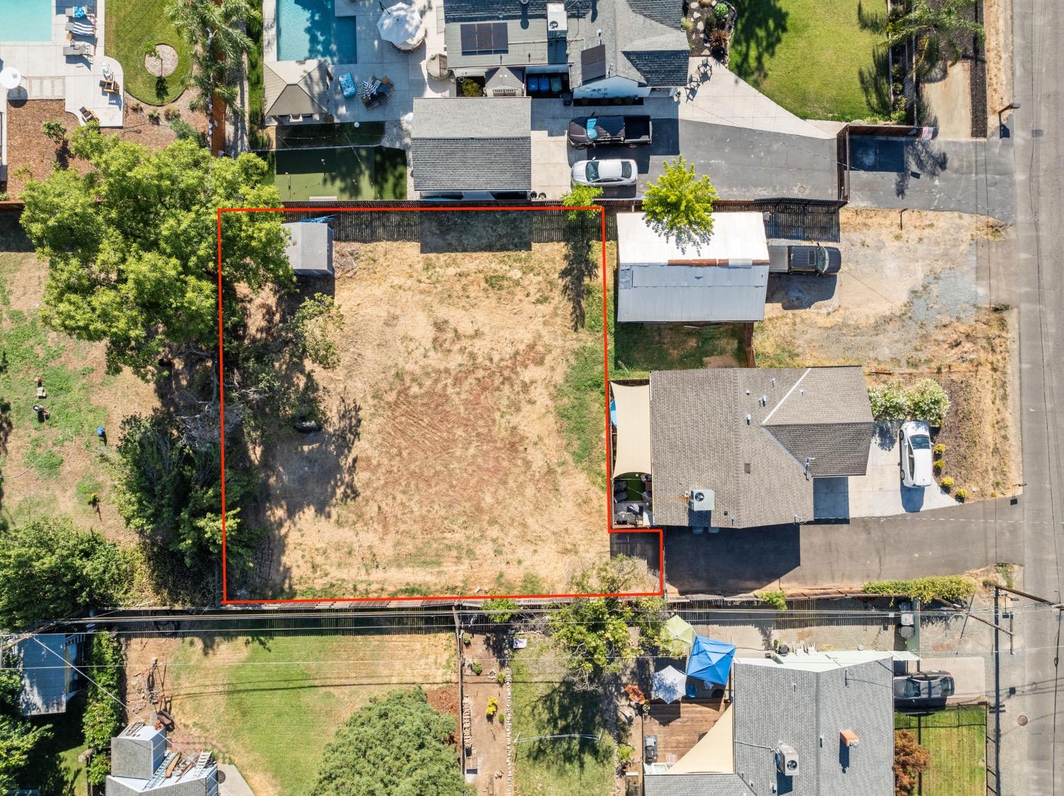 an aerial view of a house with a yard