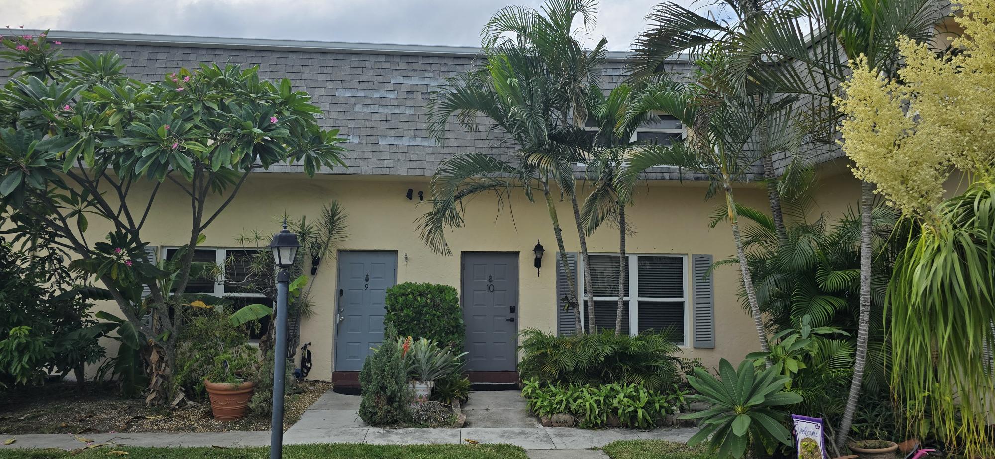 front view of a house with a garden