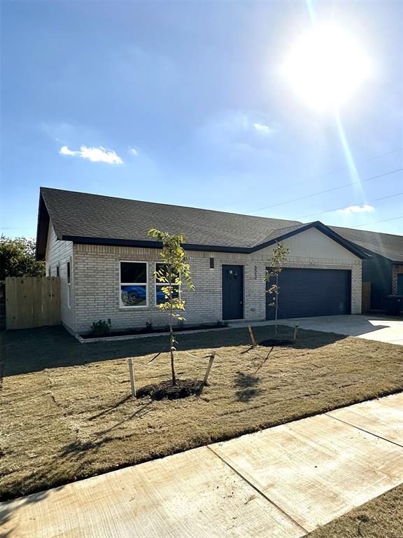 a front view of a house with yard