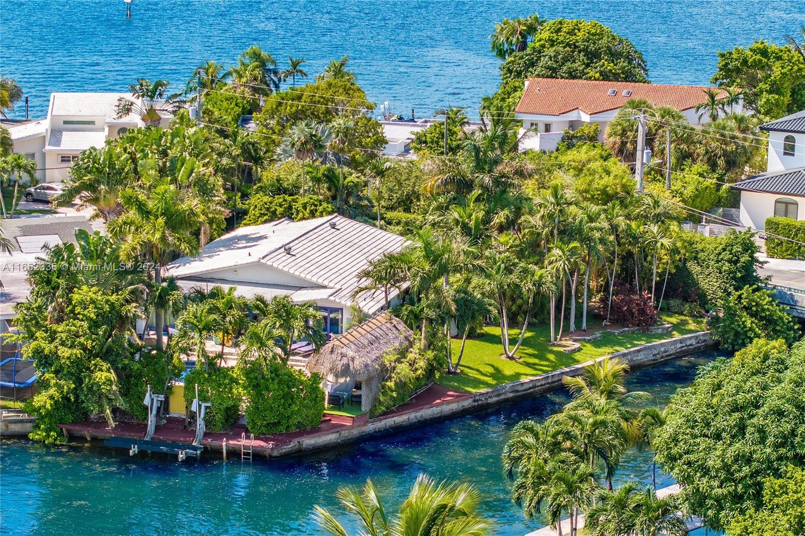 an aerial view of residential house with outdoor space and swimming pool