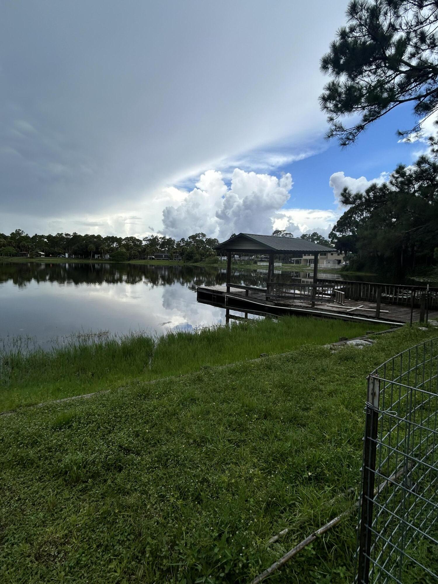 a view of a lake with houses in the back