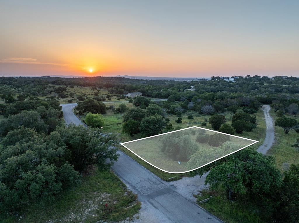 an aerial view of a golf course with a swimming pool