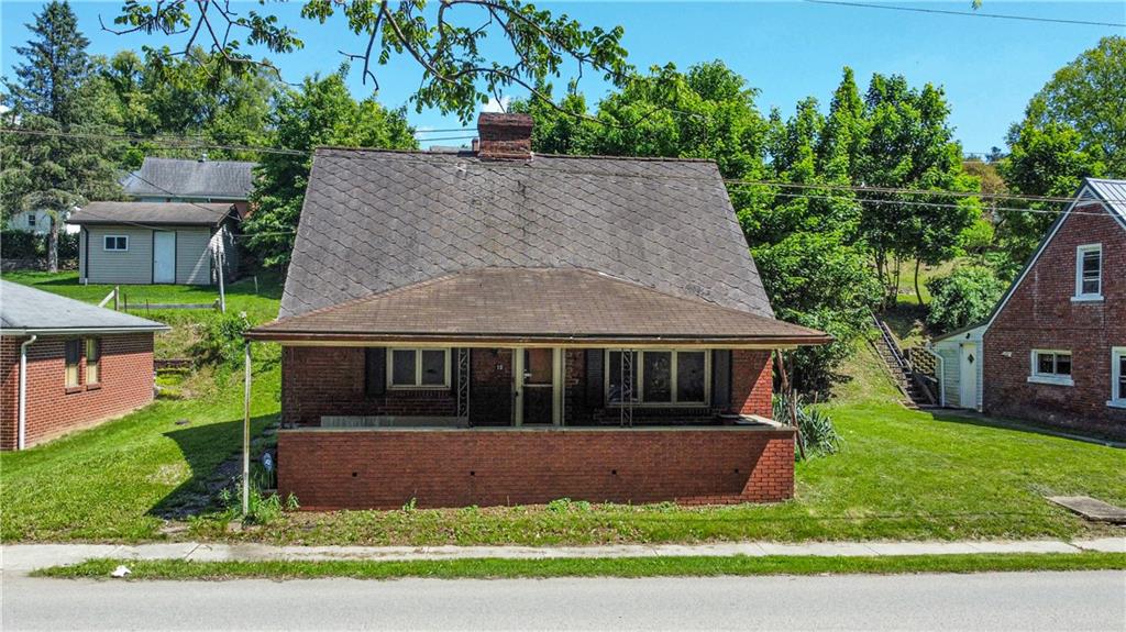 front view of house with a yard