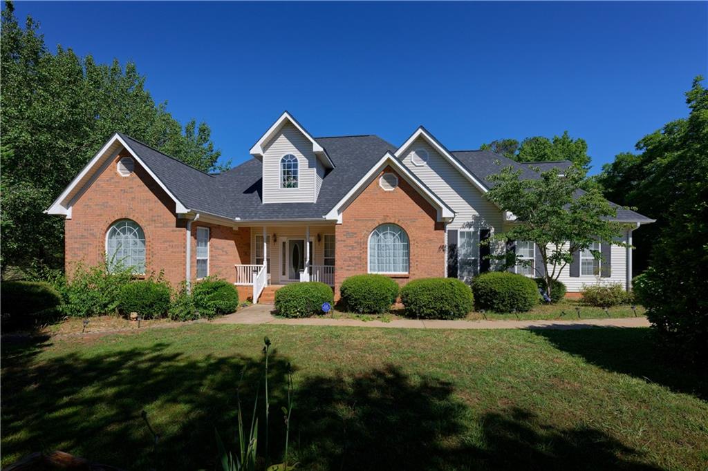 a front view of a house with a yard