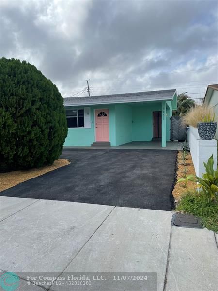 a front view of a house with yard