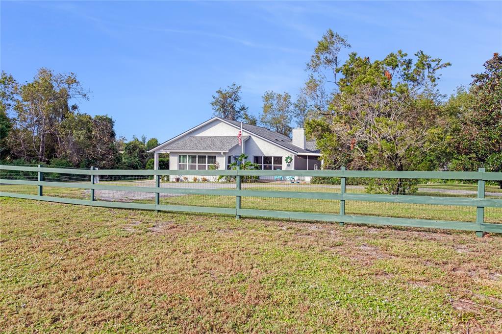 a house with trees in the background