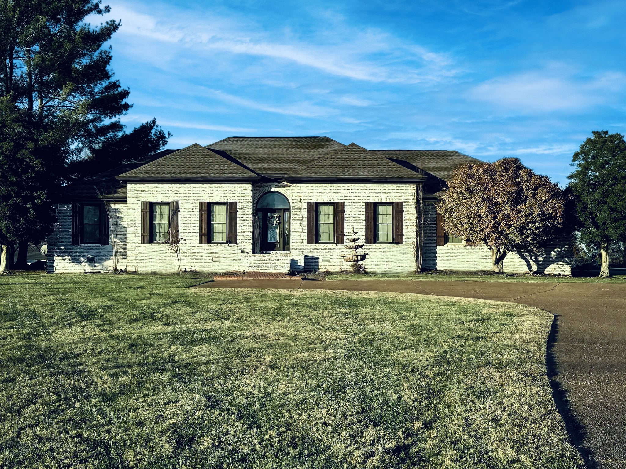 a front view of a house with a yard