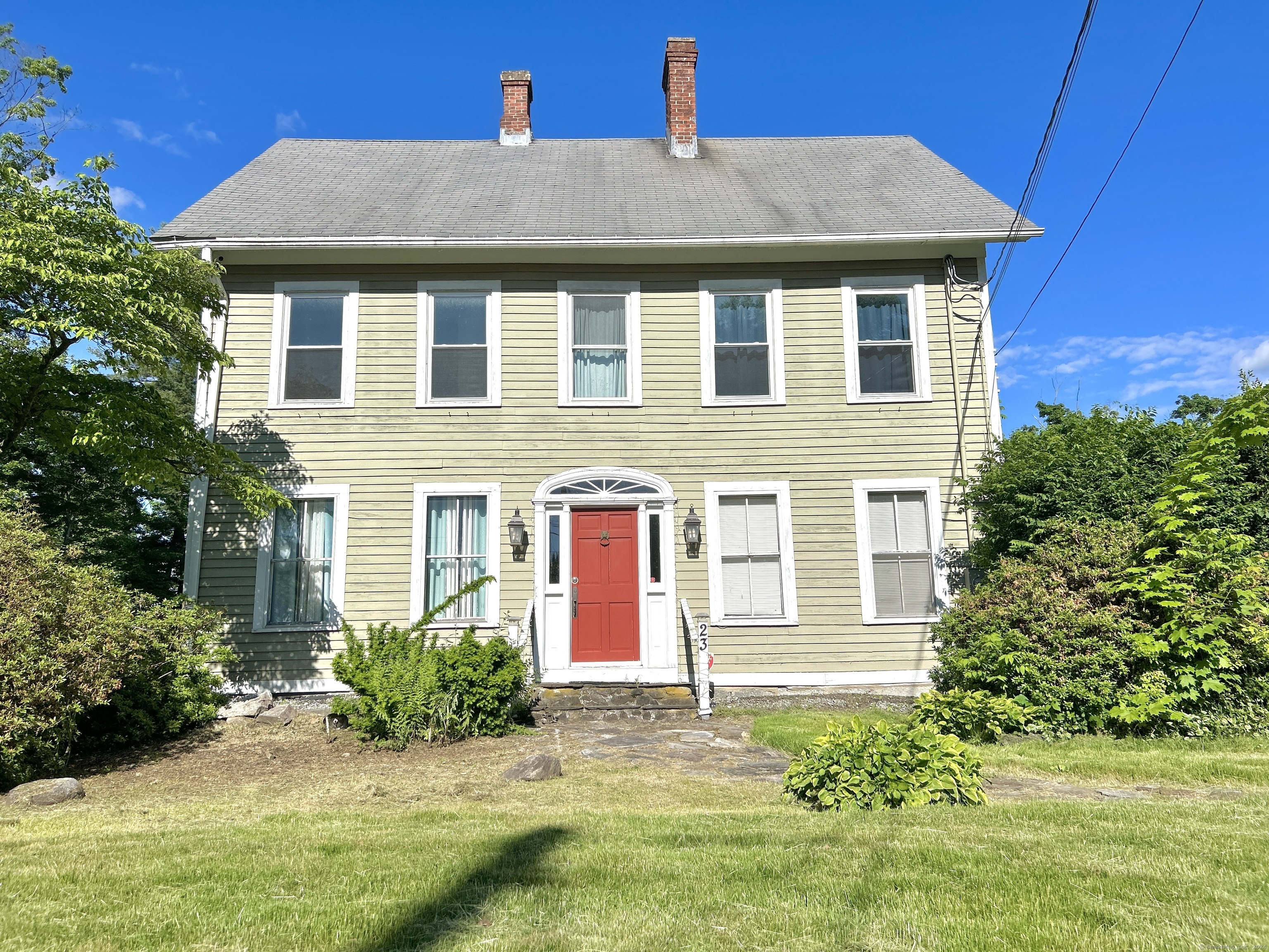 a front view of a house with a yard