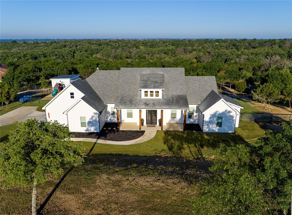 an aerial view of a house with a garden