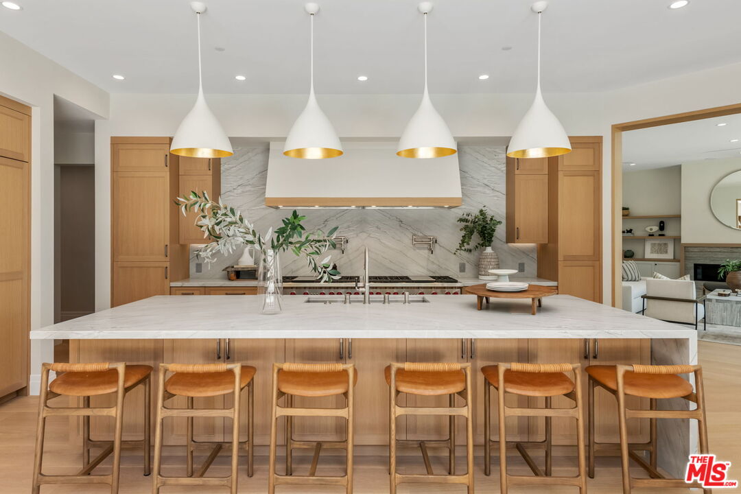 a kitchen with a table and chairs in it