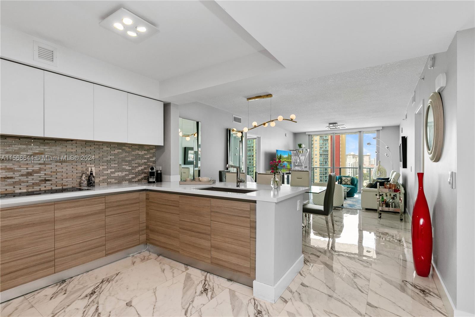 a kitchen with lots of counter top space and living room