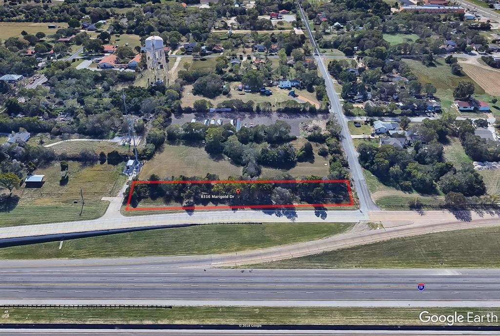 an aerial view of a house with a garden