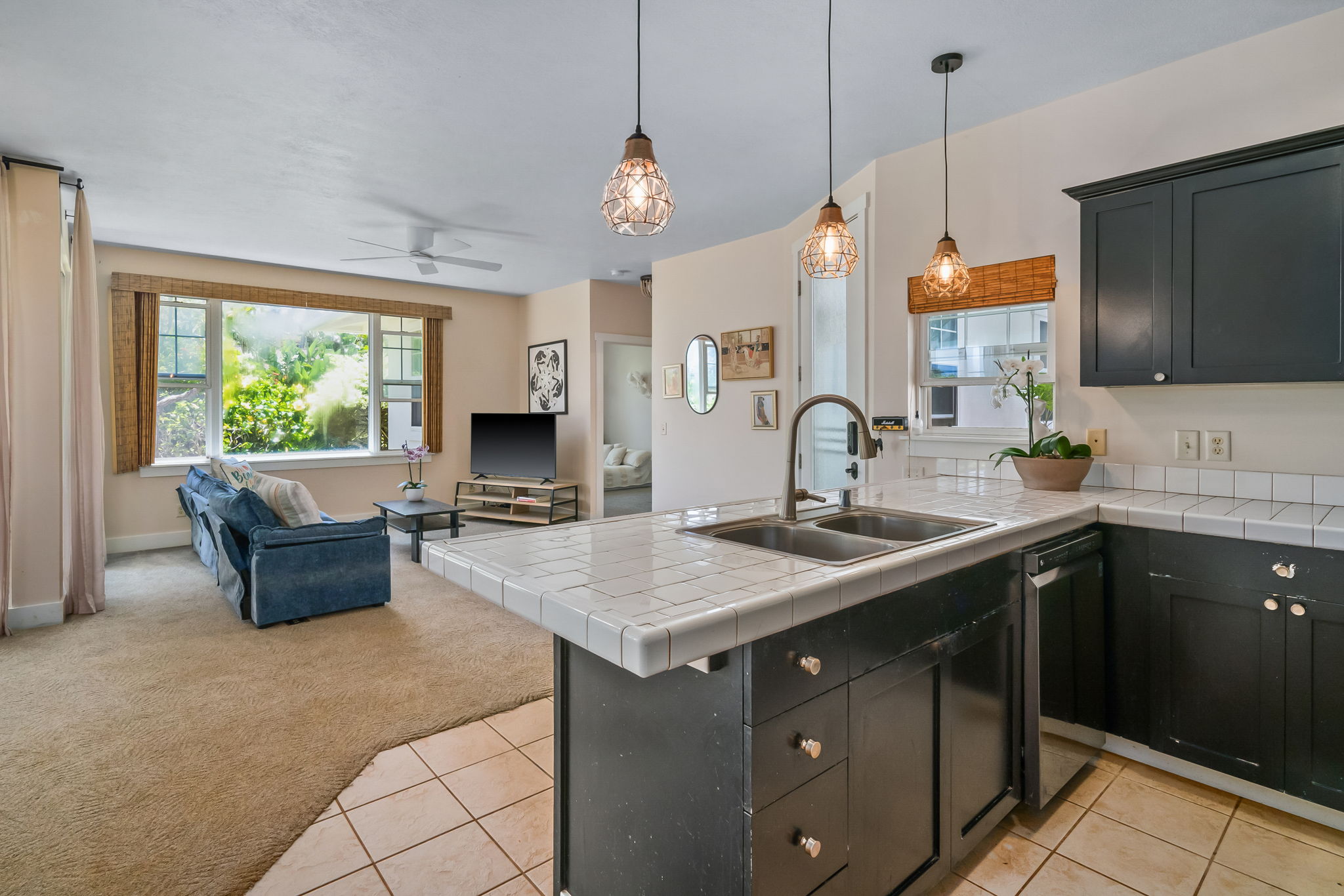 a kitchen with a stove a sink and a refrigerator