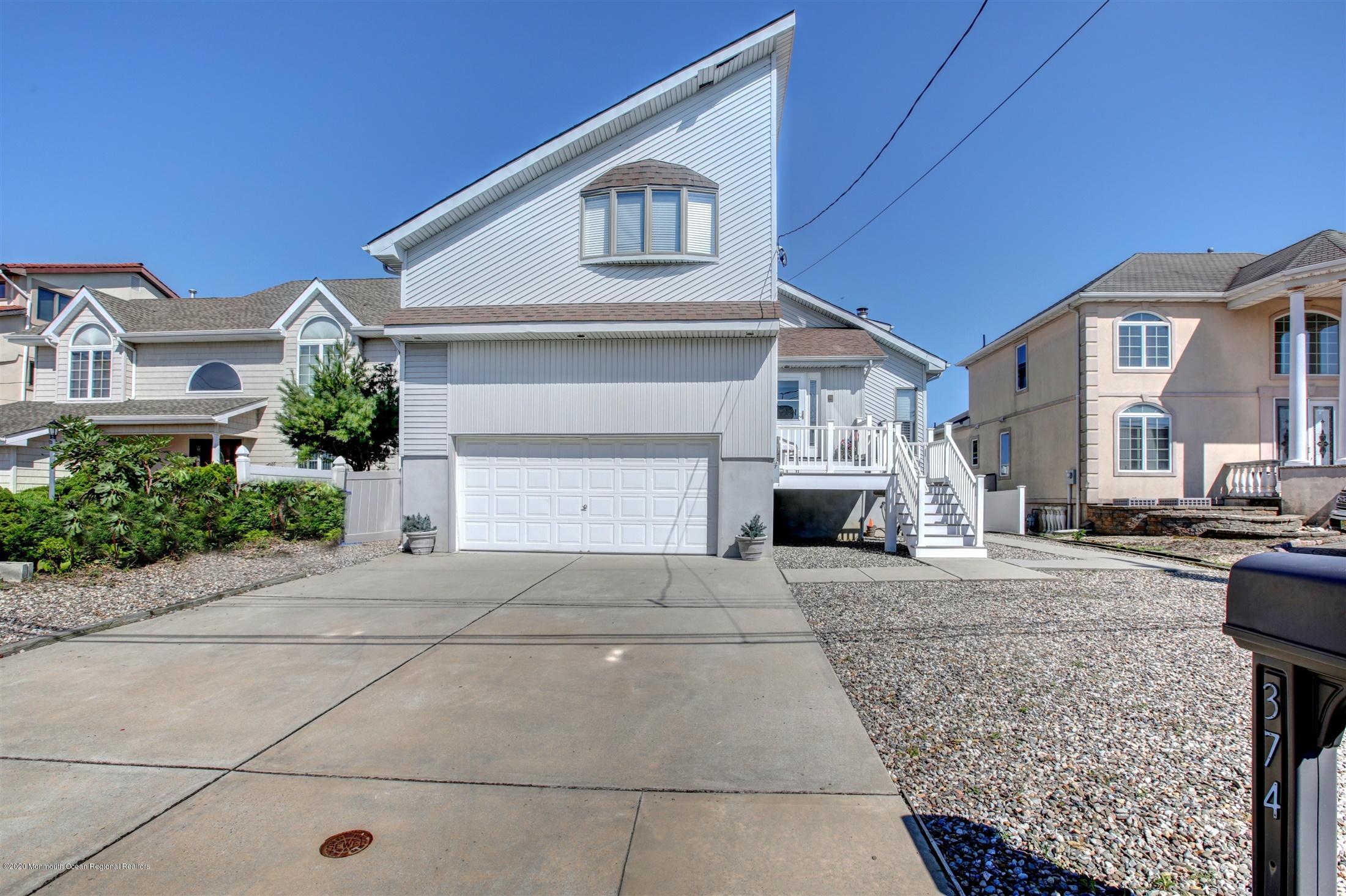 a view of a house with a street