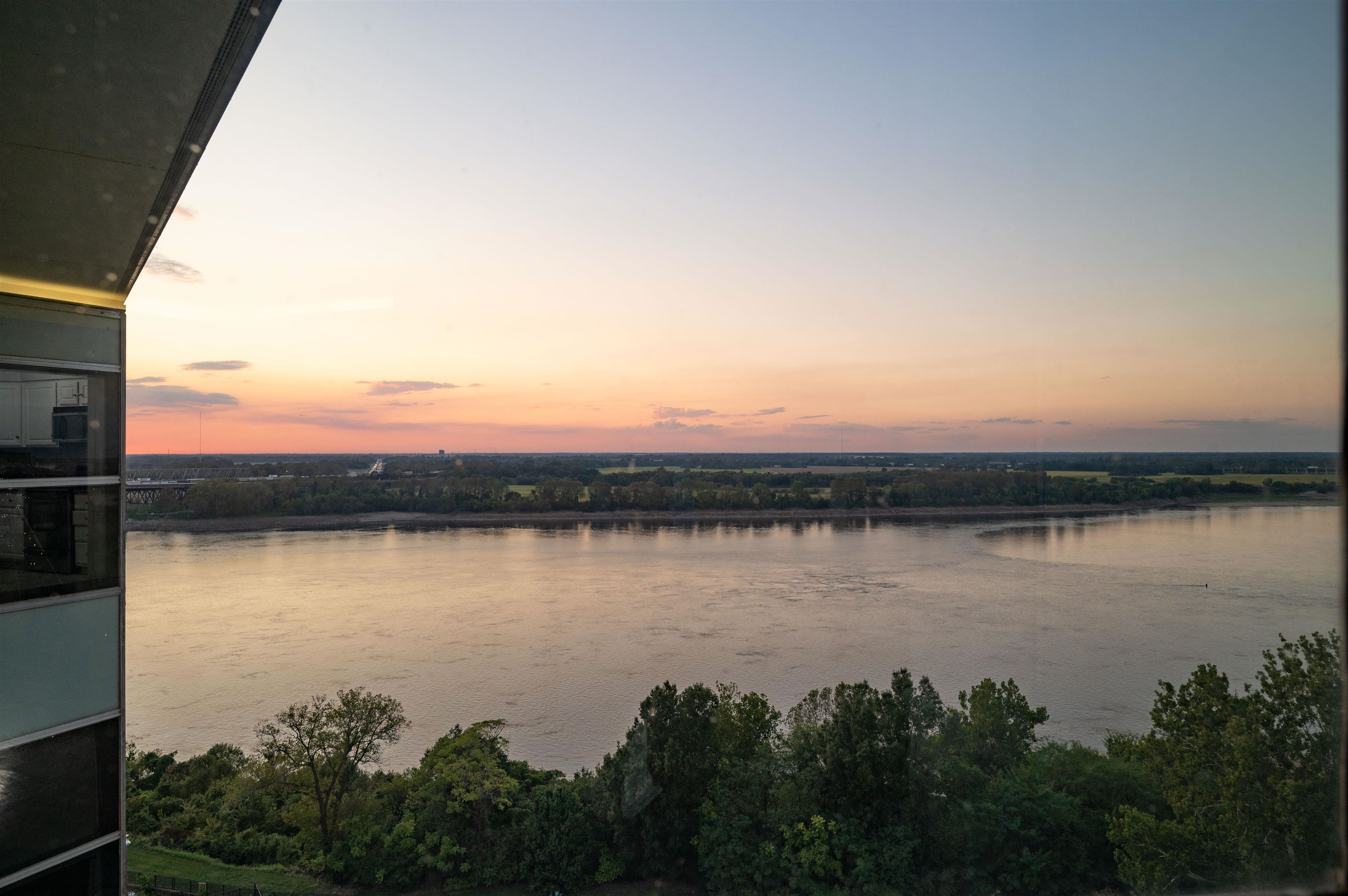 a view of a lake from a balcony