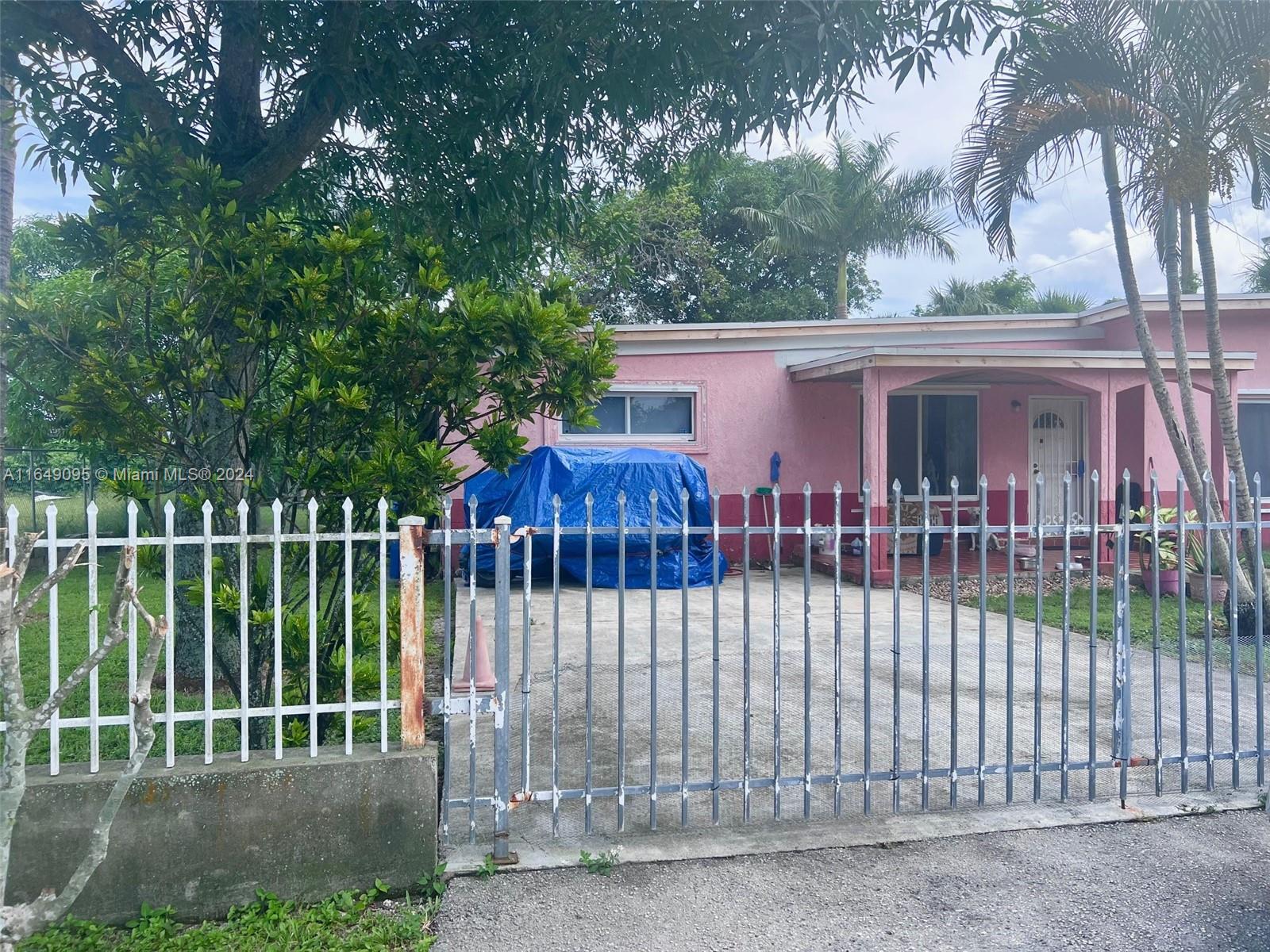 a view of a small yard and a fountain