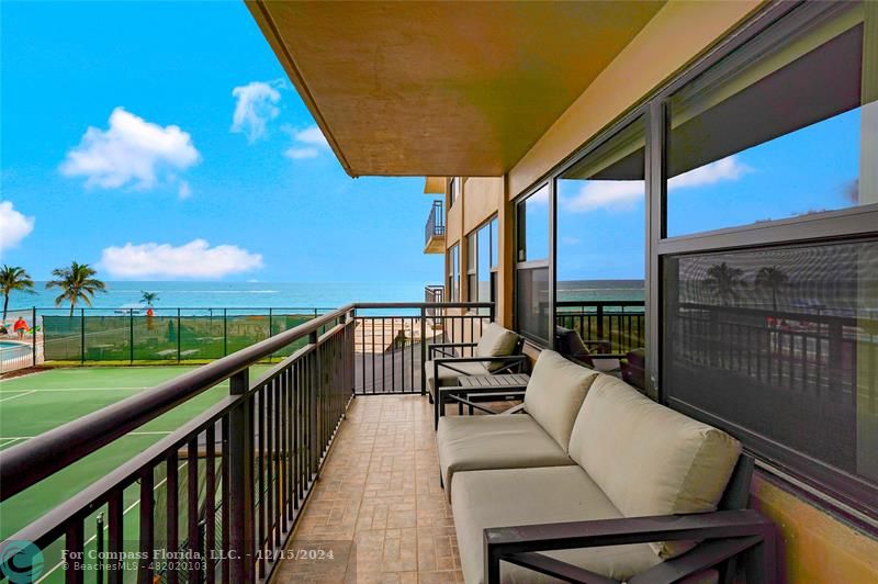 a view of balcony with furniture