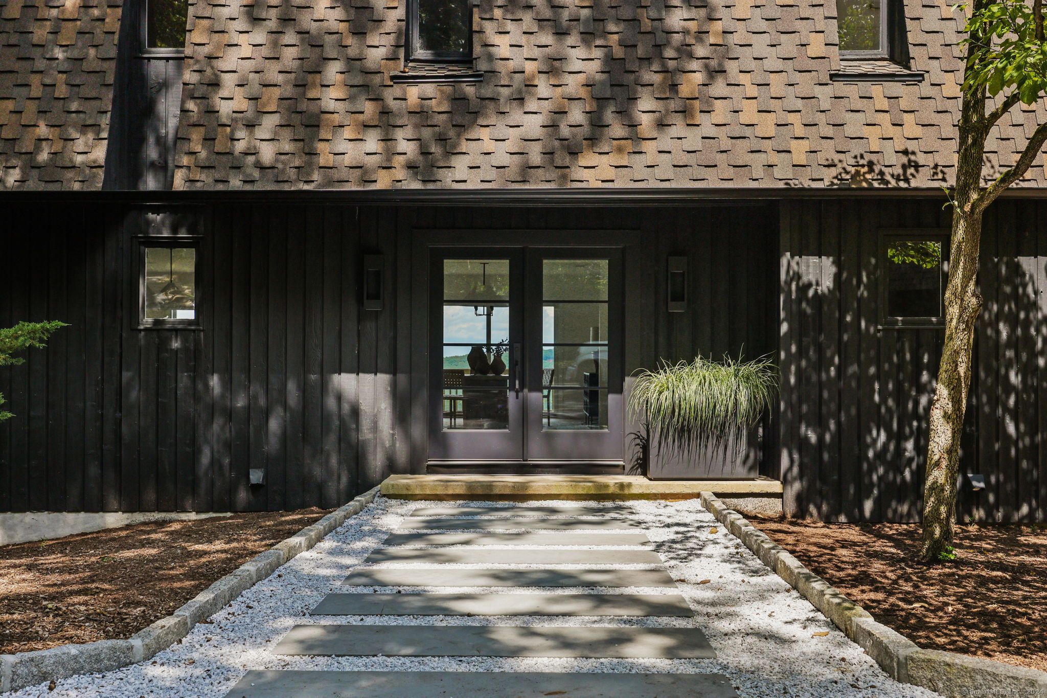 a view of backyard with porch