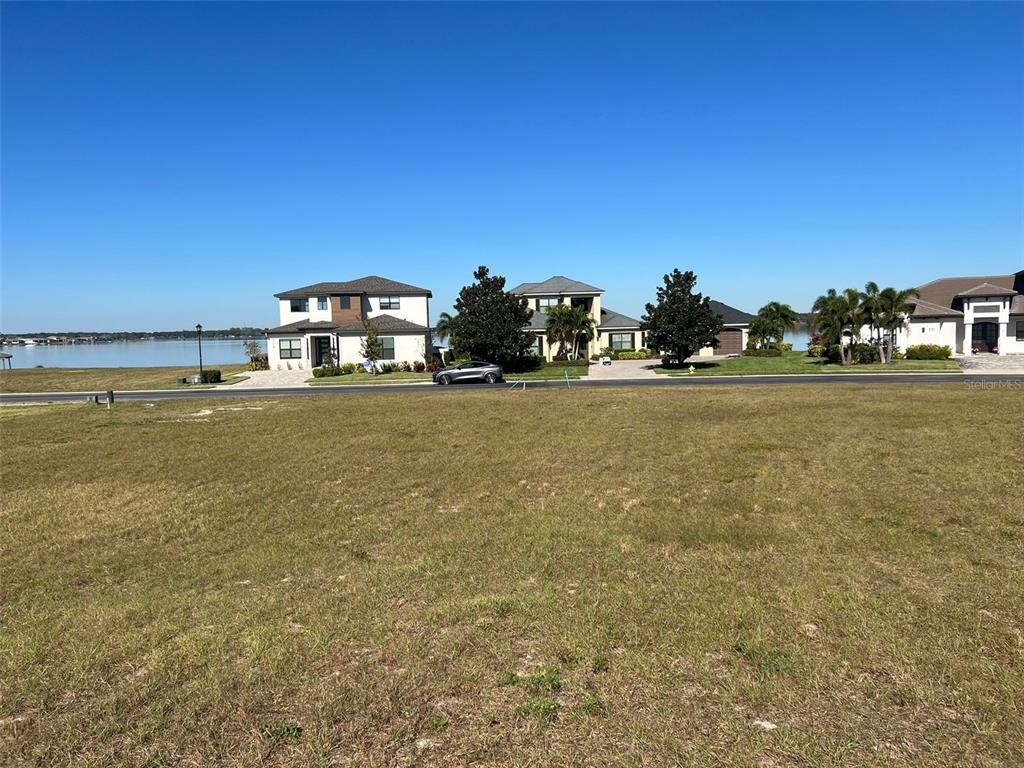 a view of a large body of water with a building in the background