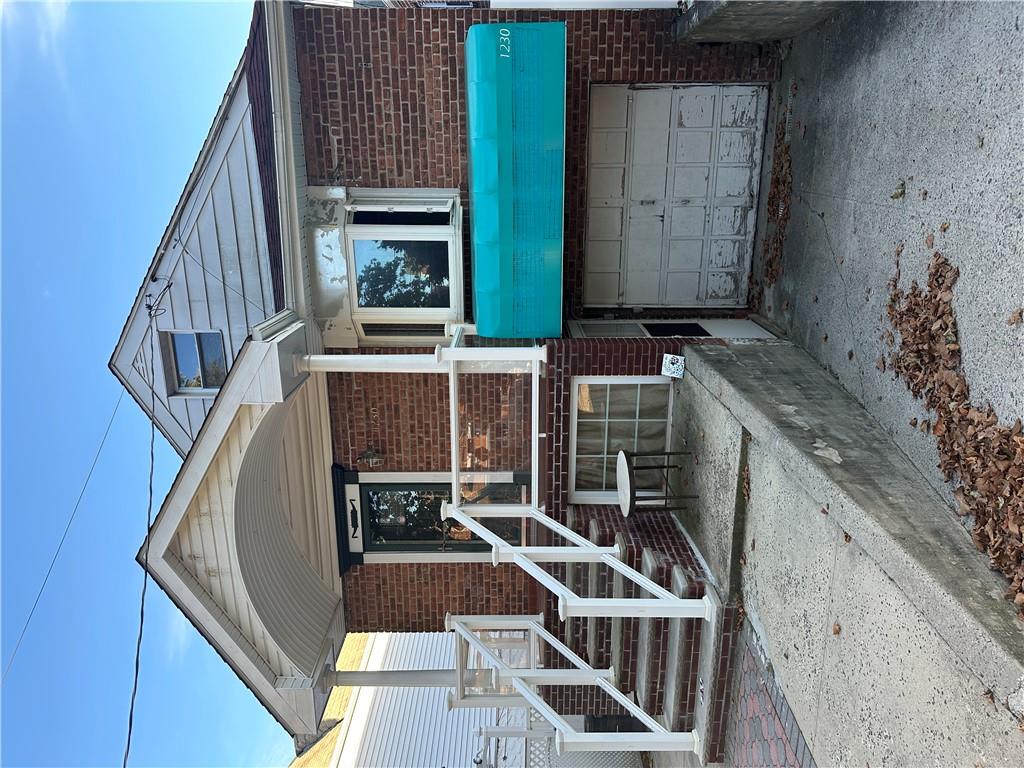 a front view of a house with garage