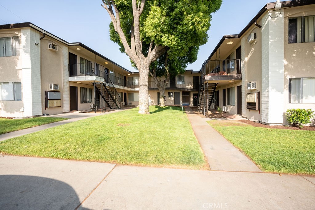 a view of a building with a yard