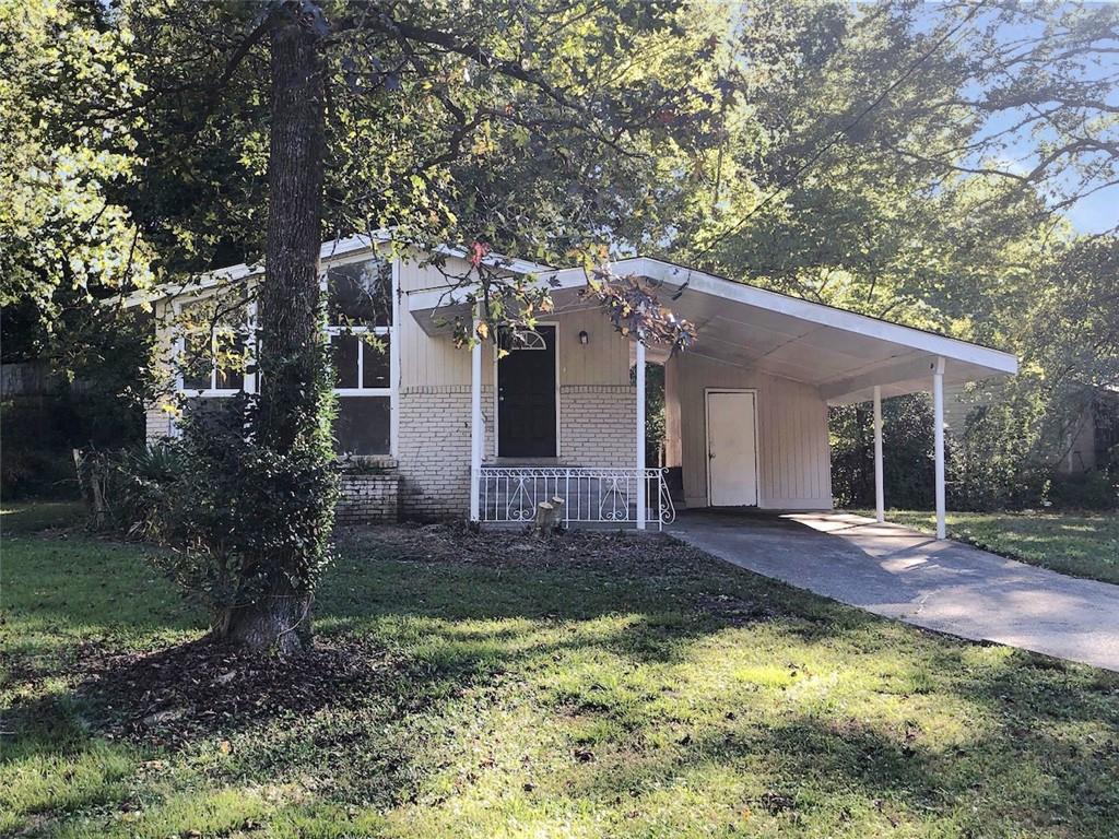 a front view of a house with a yard and porch