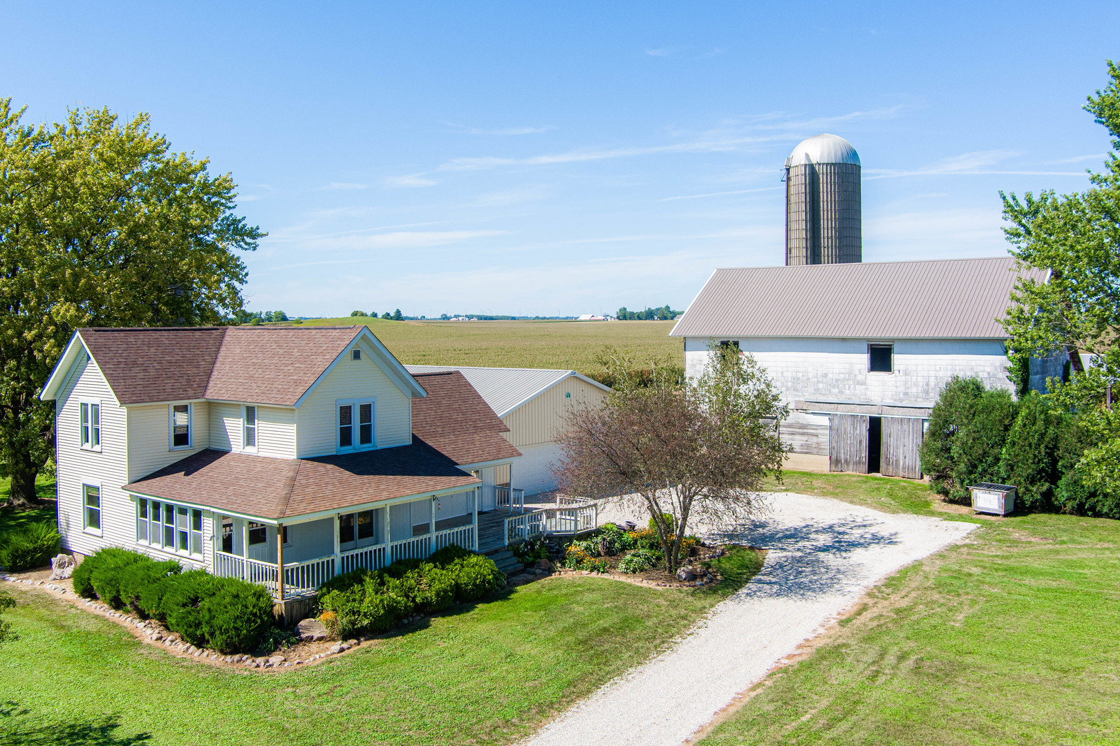 a aerial view of a house with swimming pool and a yard