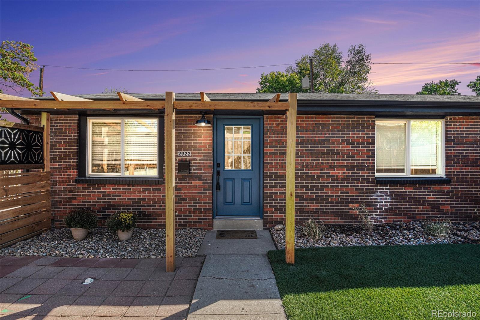 a brick house with a small yard