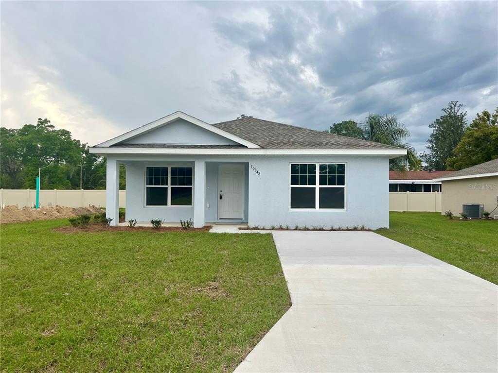 front view of a house with a yard