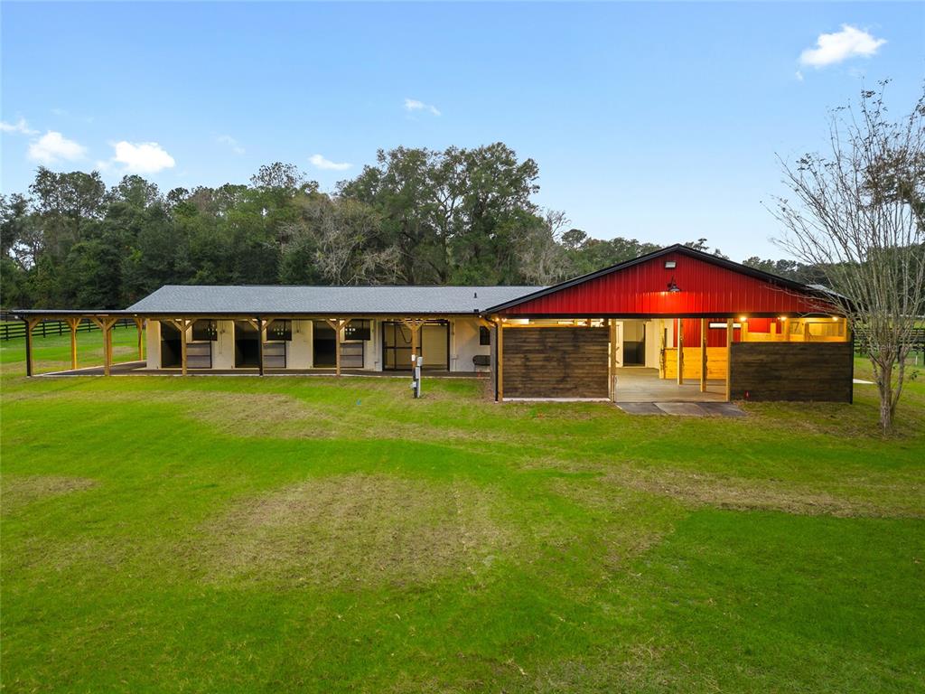 a view of house with garden and entertaining space