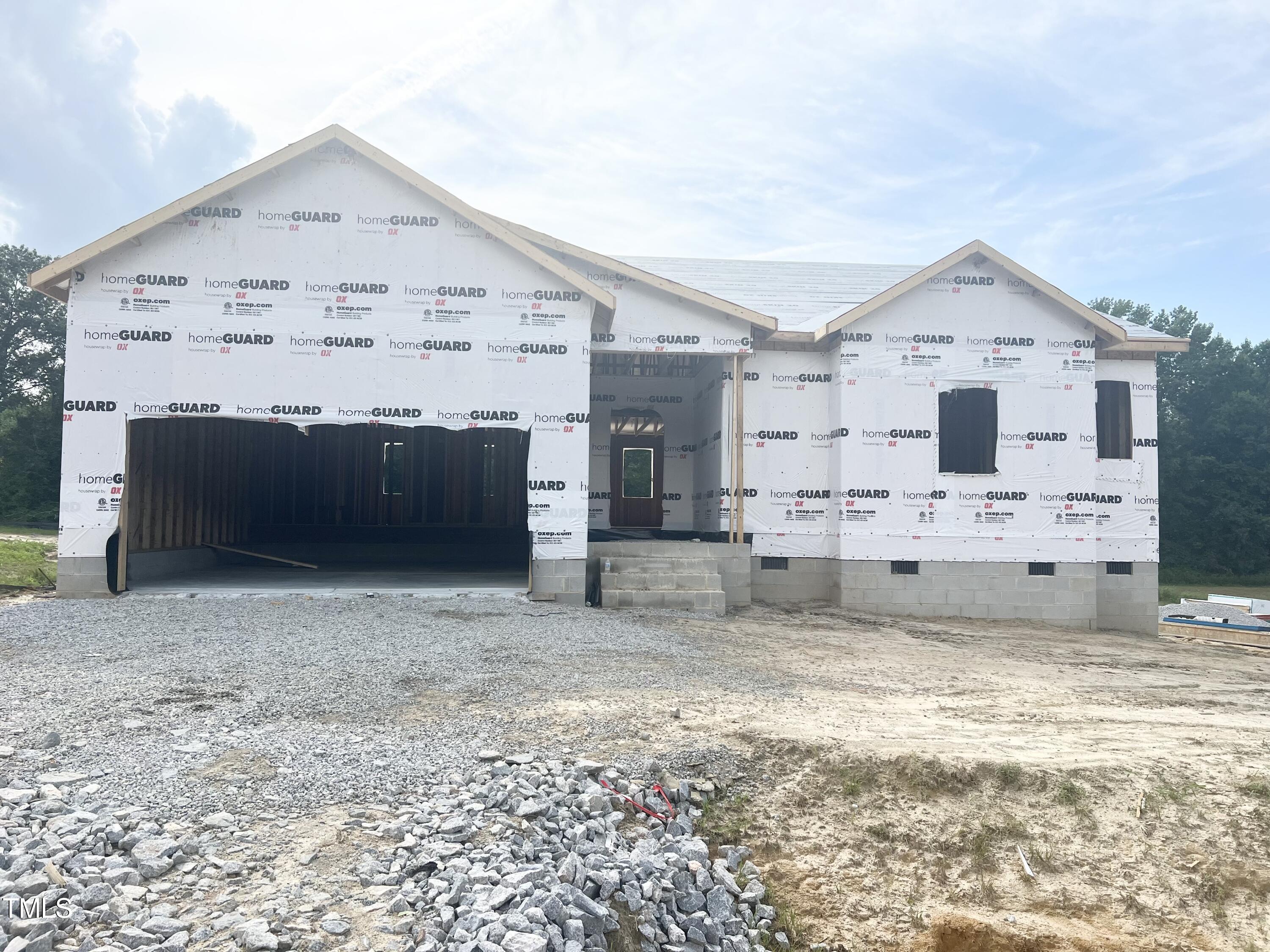 a view of a house with a yard and garage