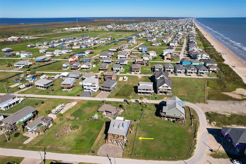 an aerial view of a residential houses with outdoor space