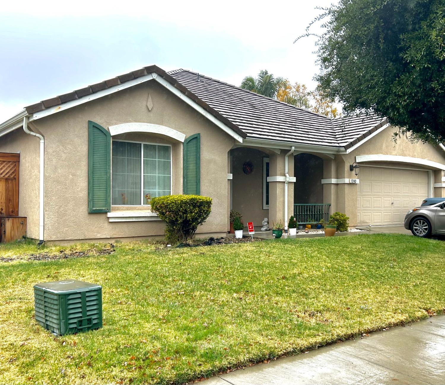 a front view of house with yard outdoor seating and barbeque oven