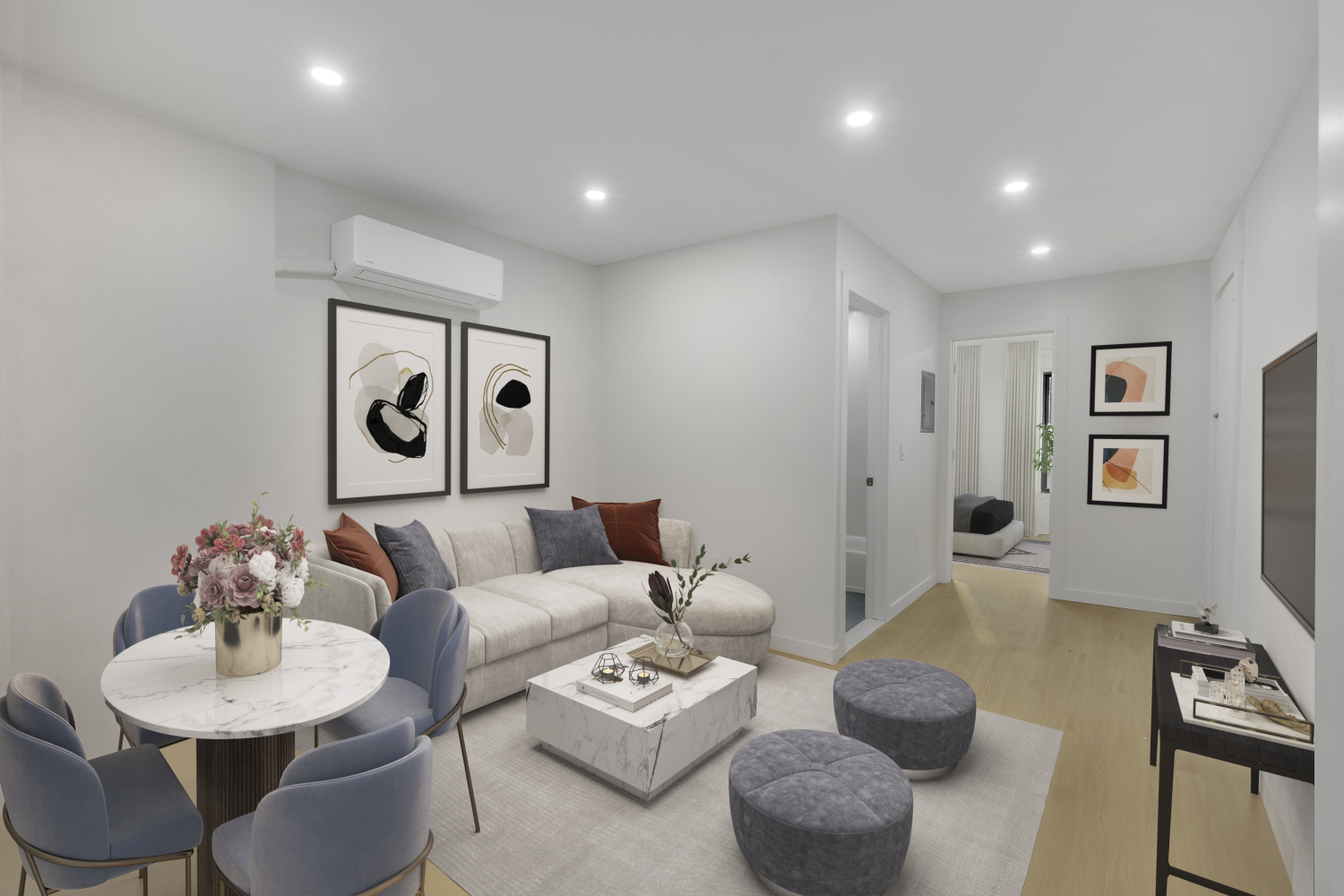 a living room with furniture and a wooden floor