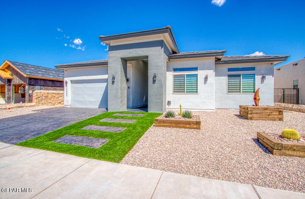 a front view of a house with garden