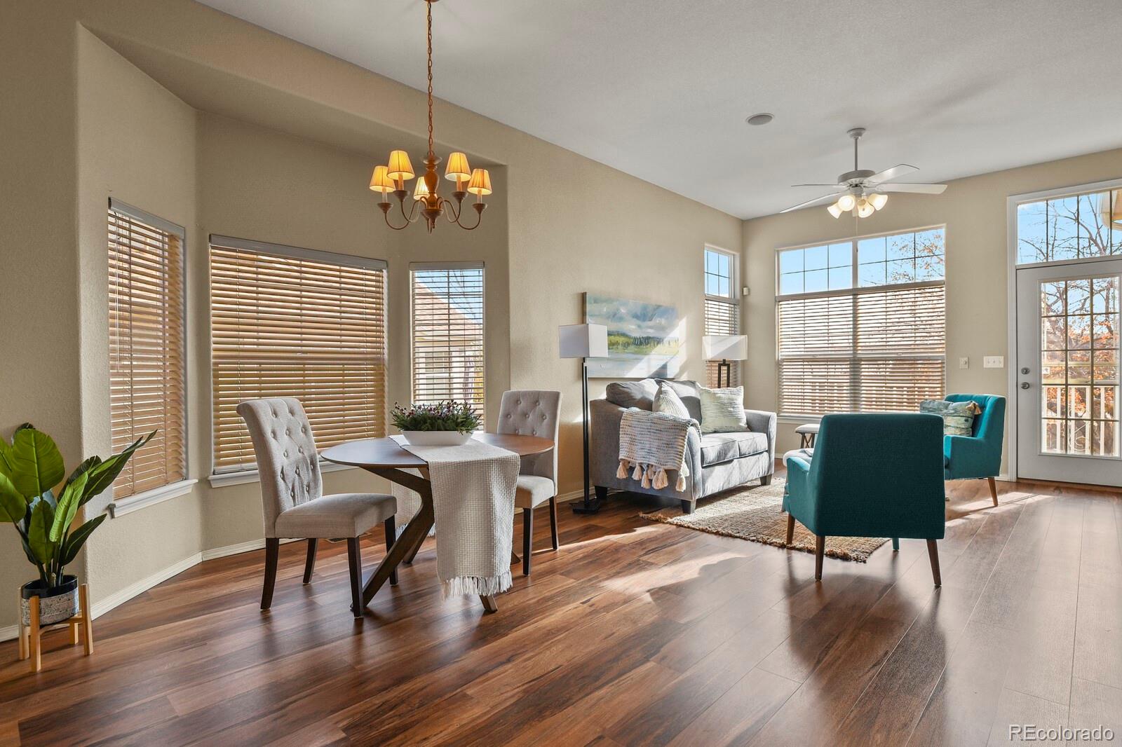 a view of a livingroom with furniture window and wooden floor