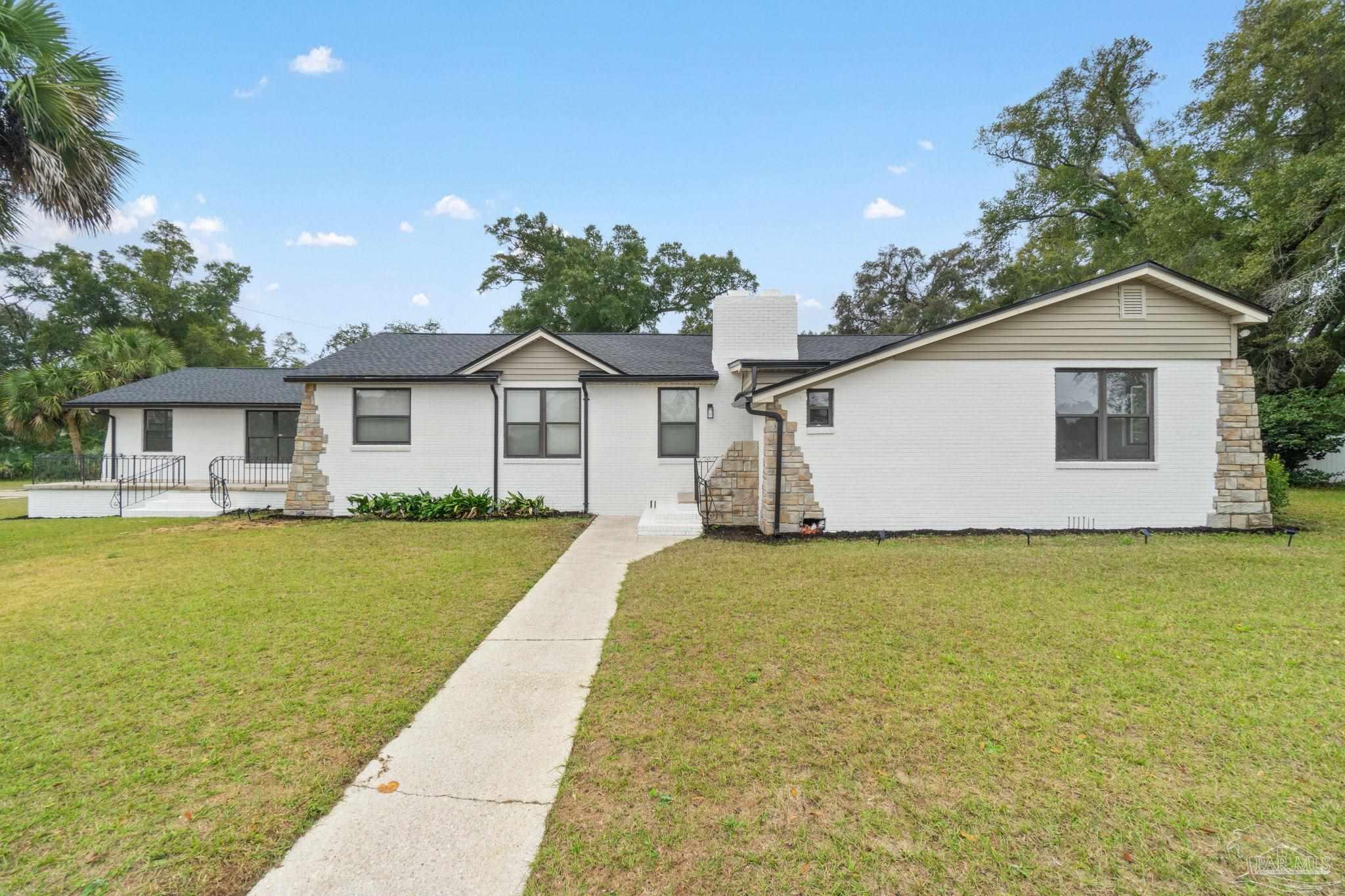 front view of a house with a yard