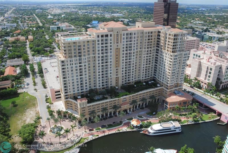 an aerial view of a city with lake view