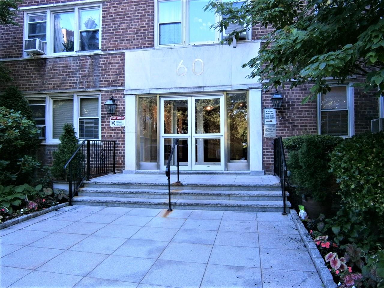 a front view of a house with a porch