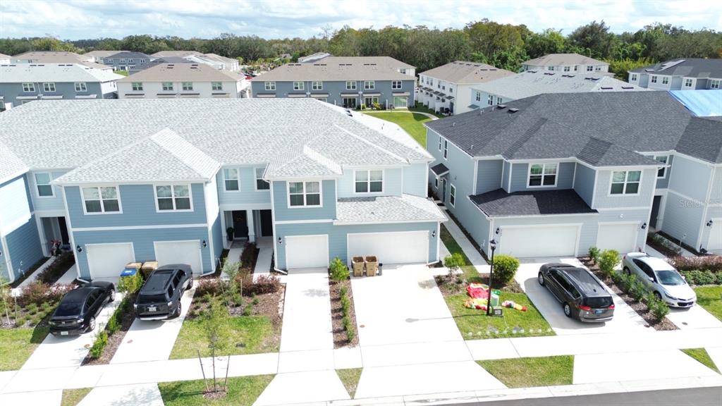 a aerial view of a house with a big yard