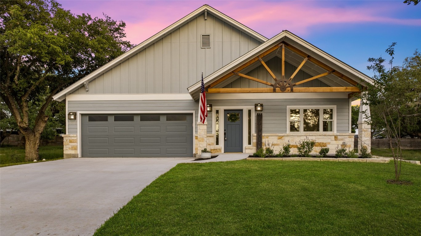 a front view of a house with a yard and yard