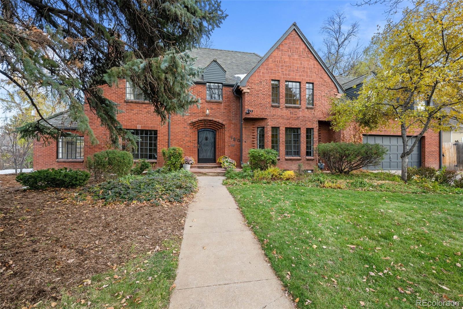 front view of a house next to a yard