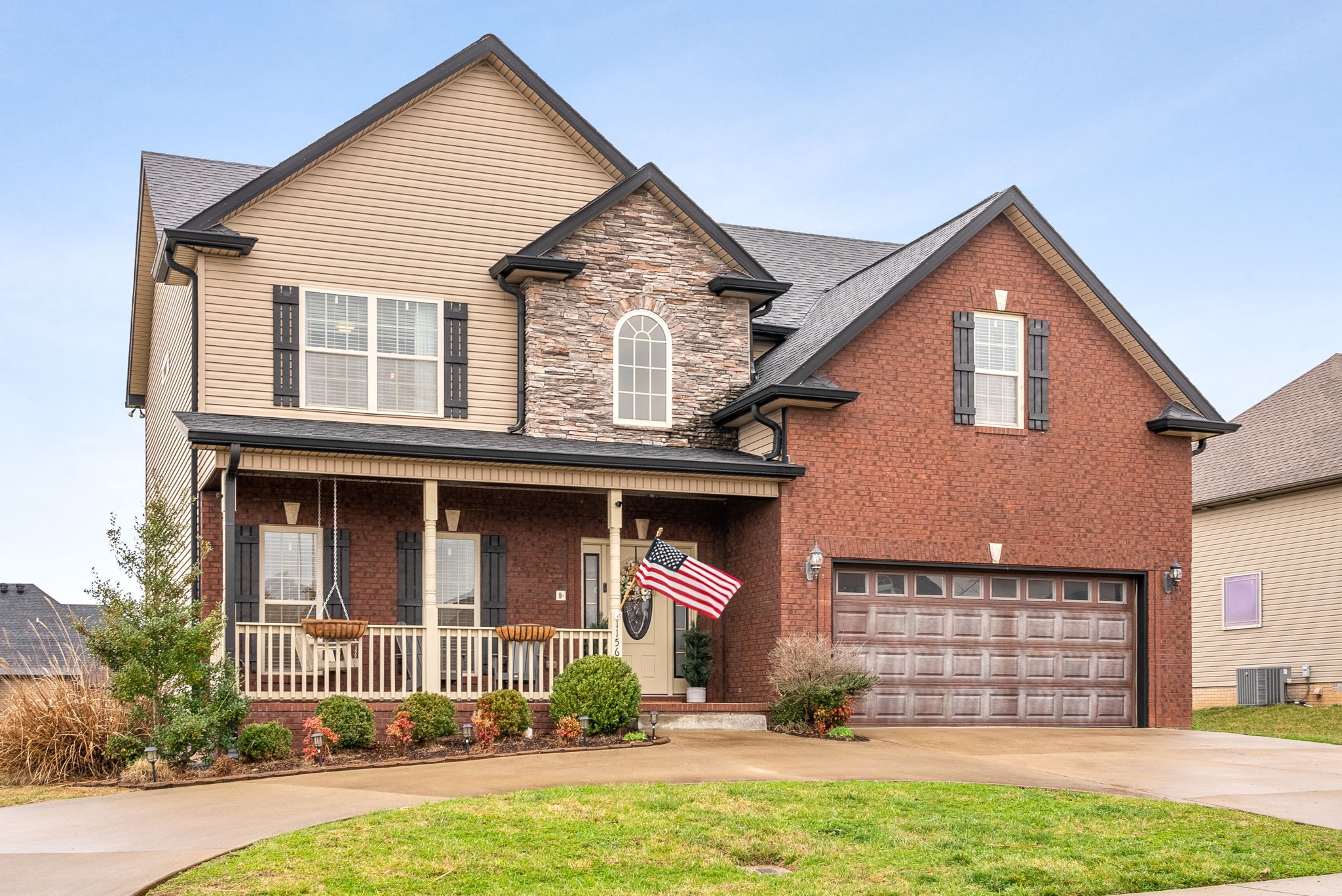 front view of a house with a yard