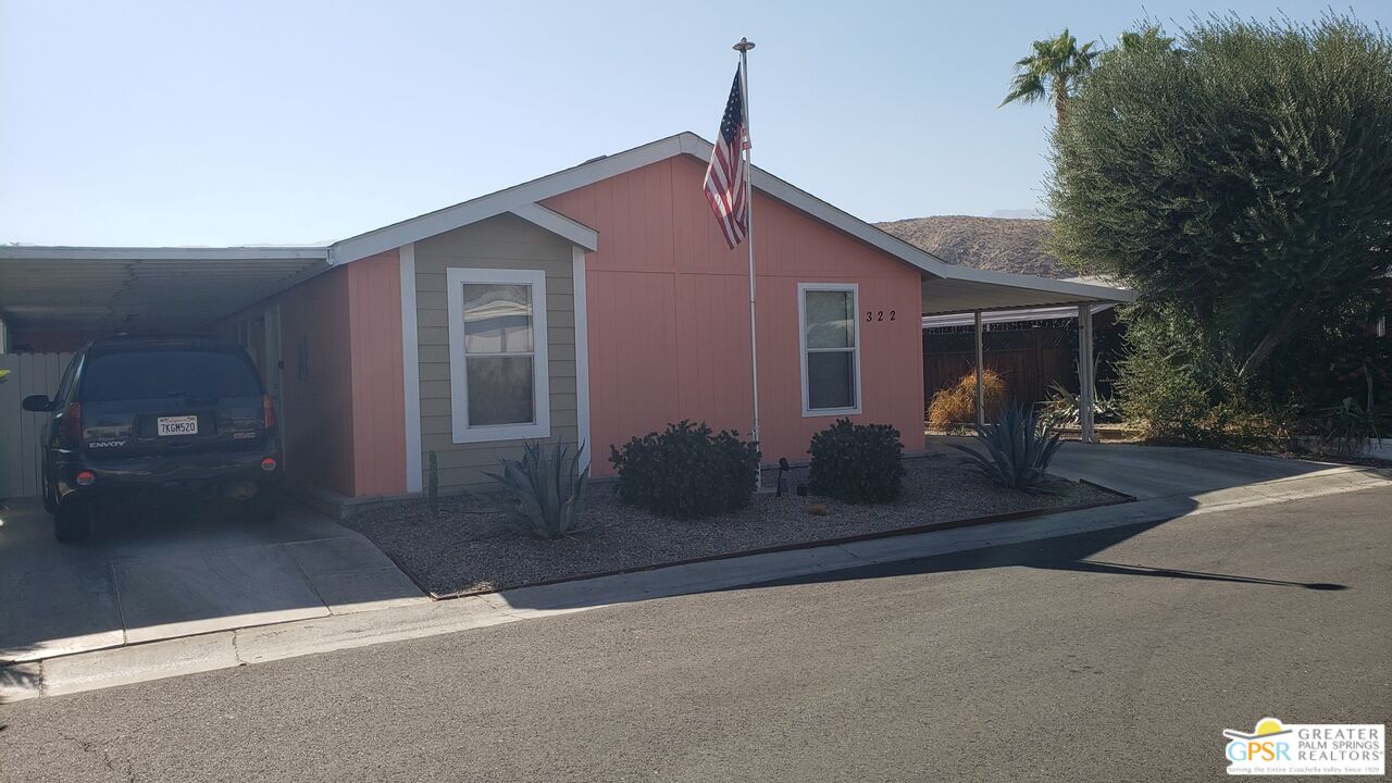 a view of a house with a street