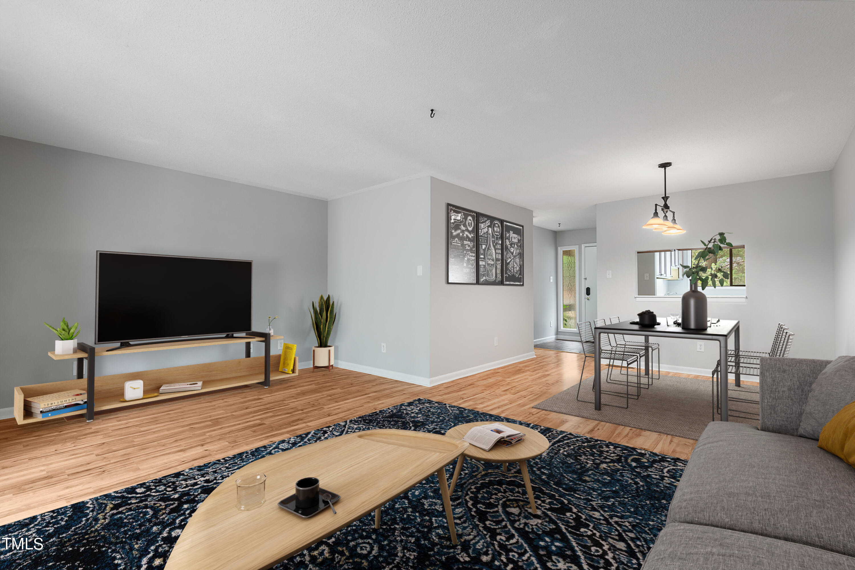 a living room with furniture and a flat screen tv