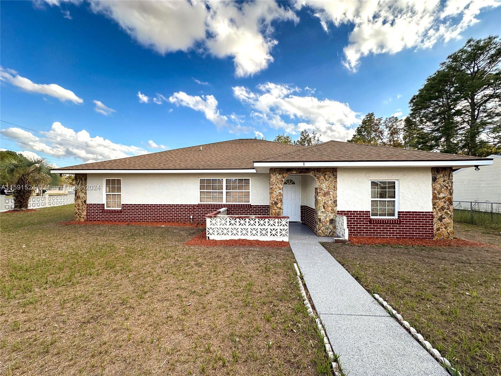 front view of a house with yard