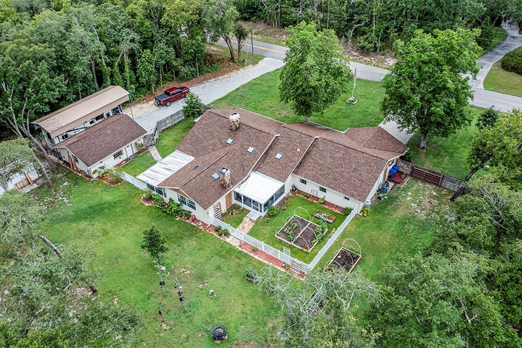 an aerial view of a house with a garden